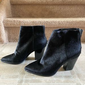 Black cow hair ankle boots with heels.